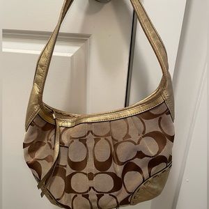 Gold and tan Coach purse